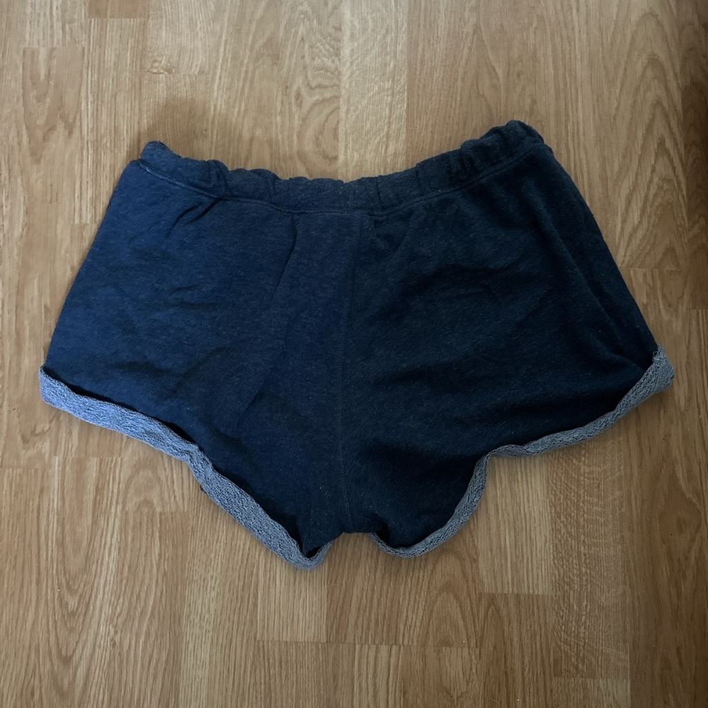 Navy blue cuffed shorts. No sign of tearing or rips.